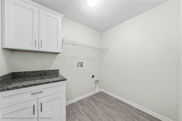 4818 Sturgeon Dr, Sebring, FL 33870 - laundry area with hookup for an electric dryer, wood finish floors, washer hookup, baseboards, and cabinet space