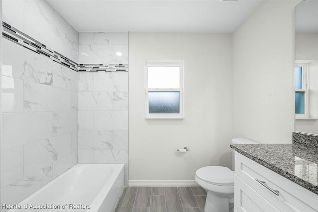 4818 Sturgeon Dr, Sebring, FL 33870 - bathroom with wood tiled floor, vanity, toilet, and baseboards