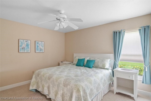 800 Spring Blvd, Sebring, FL 33876 - bedroom with light colored carpet, a ceiling fan, and baseboards