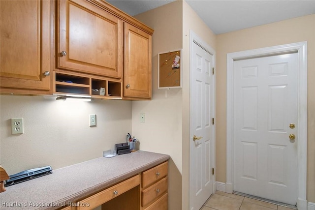 800 Spring Blvd, Sebring, FL 33876 - washroom with light tile patterned floors, an office area, and baseboards