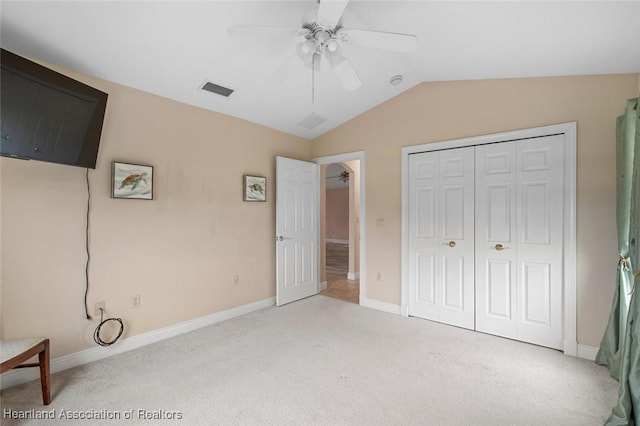 800 Spring Blvd, Sebring, FL 33876 - unfurnished bedroom with vaulted ceiling, carpet floors, baseboards, a closet, and a ceiling fan