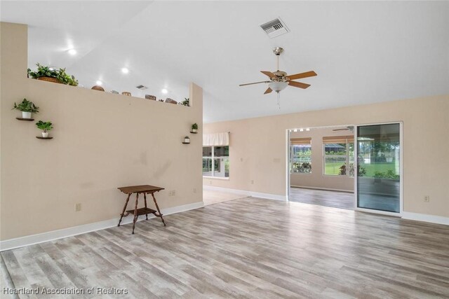 800 Spring Blvd, Sebring, FL 33876 - unfurnished room with a ceiling fan, wood finished floors, high vaulted ceiling, and baseboards