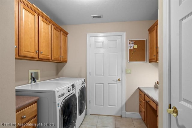 800 Spring Blvd, Sebring, FL 33876 - laundry area with cabinet space, washer and clothes dryer, and light tile patterned flooring