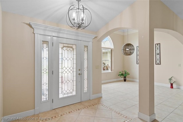 800 Spring Blvd, Sebring, FL 33876 - tiled foyer with a chandelier, arched walkways, and baseboards