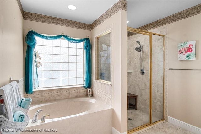 800 Spring Blvd, Sebring, FL 33876 - full bathroom with a stall shower, a bath, healthy amount of natural light, and baseboards
