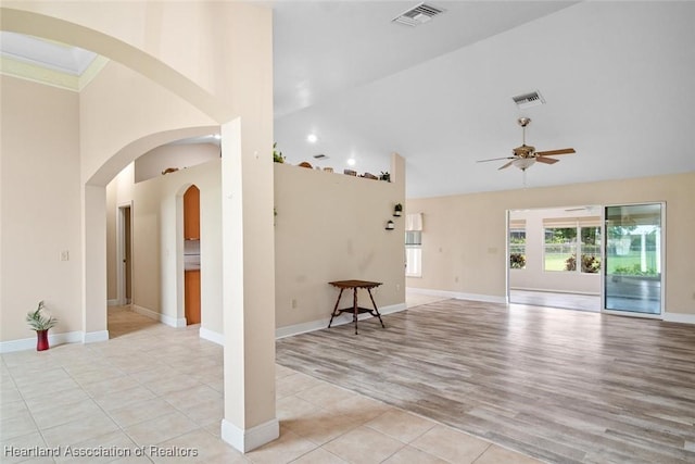 800 Spring Blvd, Sebring, FL 33876 - living area with a ceiling fan, high vaulted ceiling, light wood-type flooring, and baseboards