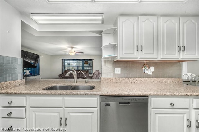 kitchen featuring white cabinetry, dishwasher, ceiling fan, sink, and kitchen peninsula