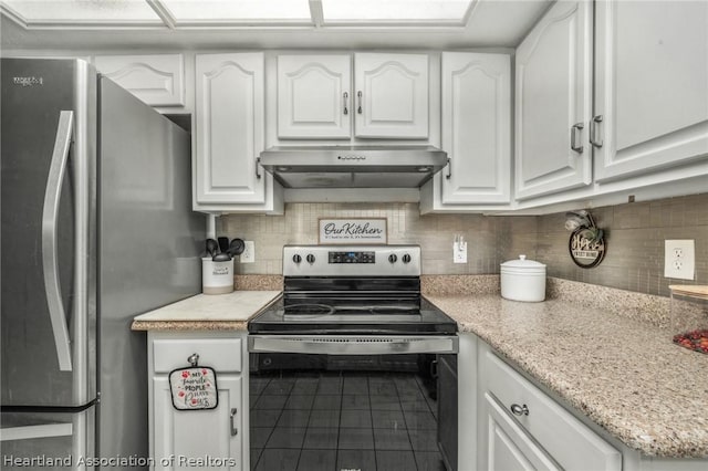 kitchen with stainless steel appliances, tile patterned floors, backsplash, white cabinets, and exhaust hood