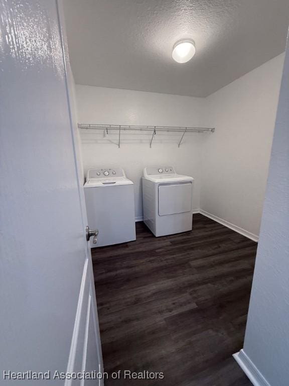 525 Central Ln, Frostproof, FL 33843 - washroom with washing machine and clothes dryer, wood finished floors, baseboards, and a textured ceiling