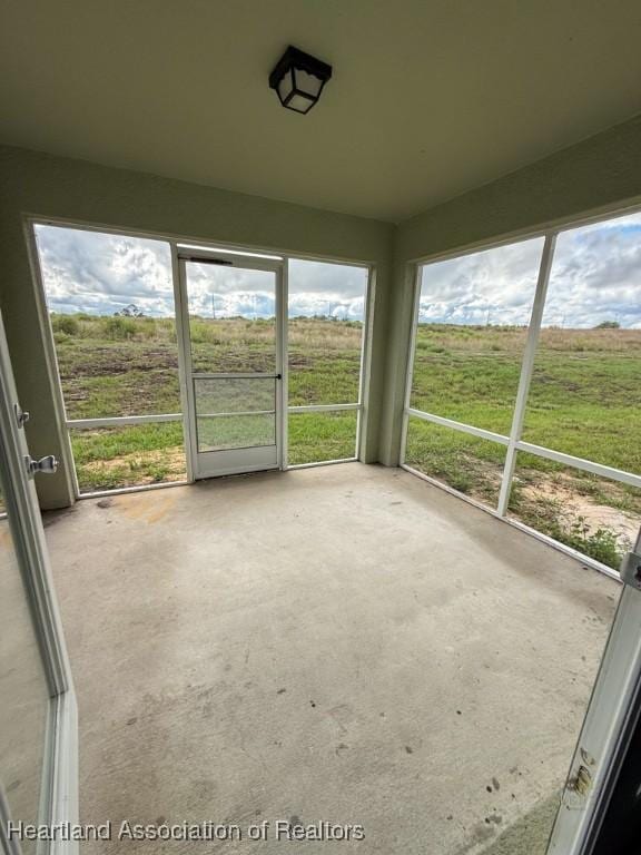 525 Central Ln, Frostproof, FL 33843 - unfurnished sunroom featuring plenty of natural light