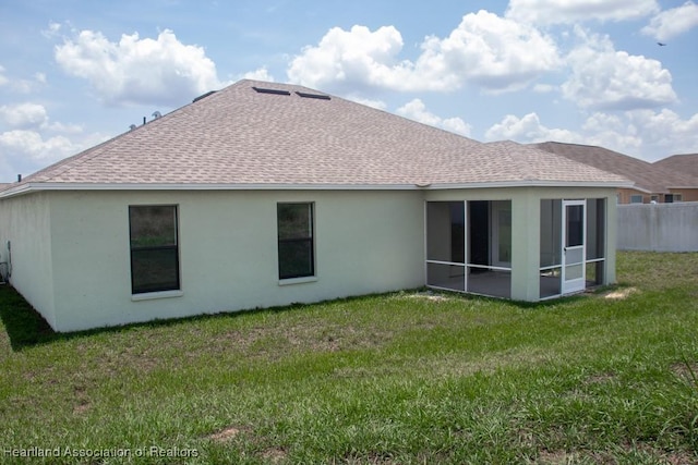 525 Central Ln, Frostproof, FL 33843 - back of property featuring roof with shingles, stucco siding, and a sunroom