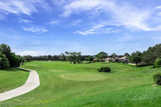 view of property's community featuring a yard