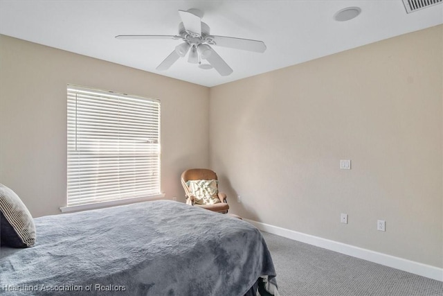 carpeted bedroom with ceiling fan