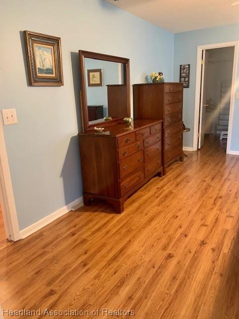 bedroom with light wood-type flooring