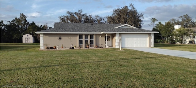 ranch-style house featuring a garage, a shed, and a front lawn