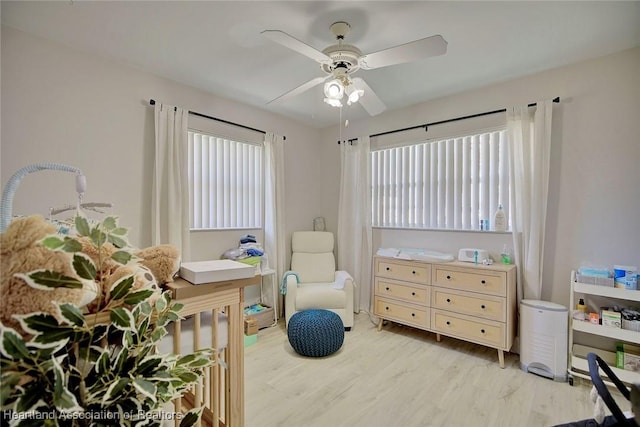 sitting room featuring ceiling fan and light hardwood / wood-style flooring