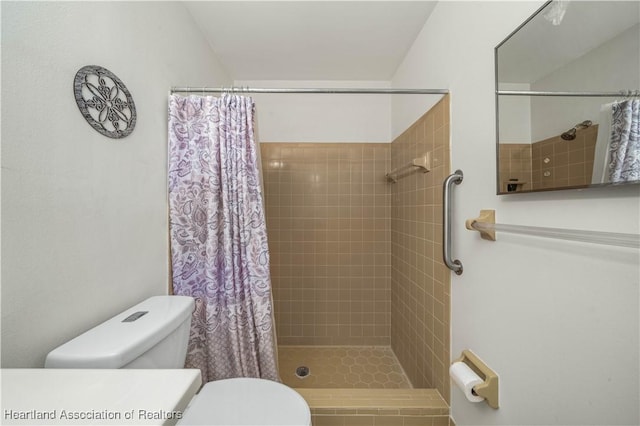 bathroom with toilet and walk in shower