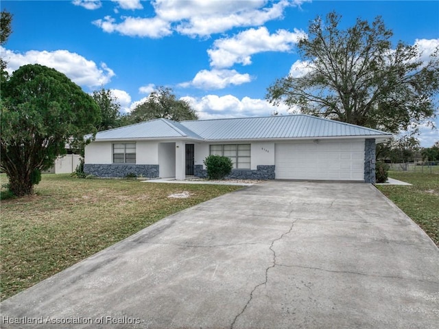 ranch-style home with a garage and a front yard