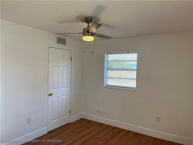 unfurnished room featuring ceiling fan and wood-type flooring