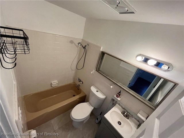 full bathroom with tile patterned floors, toilet, vanity, and tub / shower combination