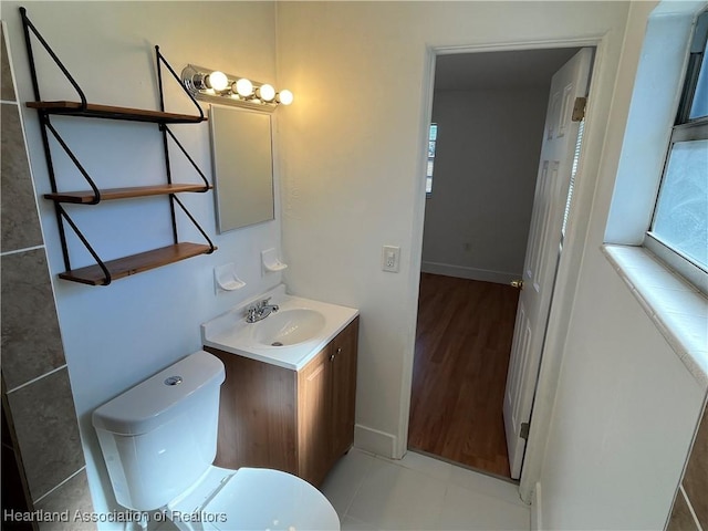 bathroom featuring vanity and toilet