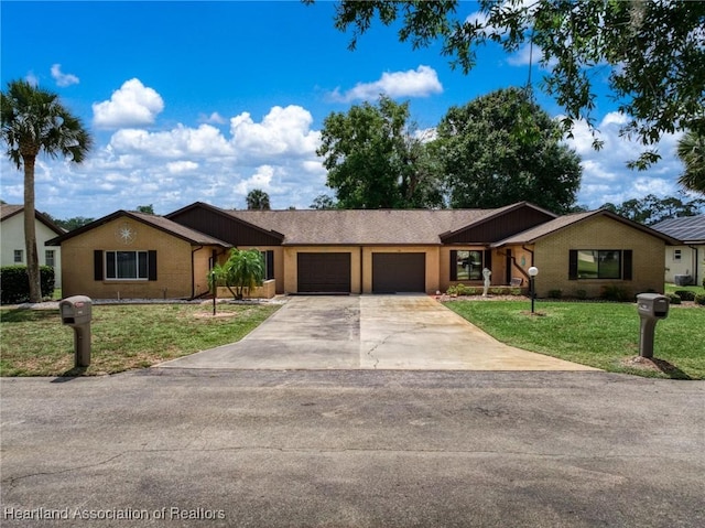 158 Parkview Cir, Lake Placid, FL 33852 - ranch-style home featuring a garage, a front yard, concrete driveway, and brick siding