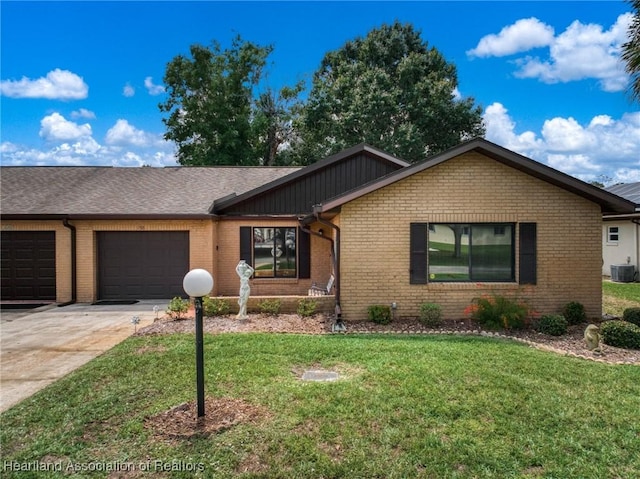 158 Parkview Cir, Lake Placid, FL 33852 - ranch-style home featuring a garage, brick siding, cooling unit, a front yard, and concrete driveway