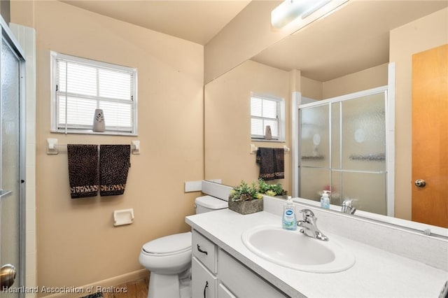 158 Parkview Cir, Lake Placid, FL 33852 - full bathroom with a stall shower, toilet, vanity, baseboards, and wood finished floors