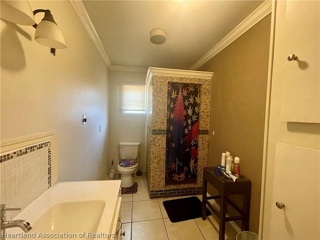 bathroom with tile patterned flooring, toilet, crown molding, and sink