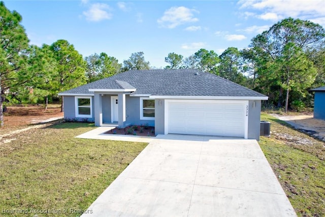 single story home with central air condition unit, a front lawn, and a garage