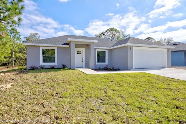 view of front of property with a front lawn and a garage