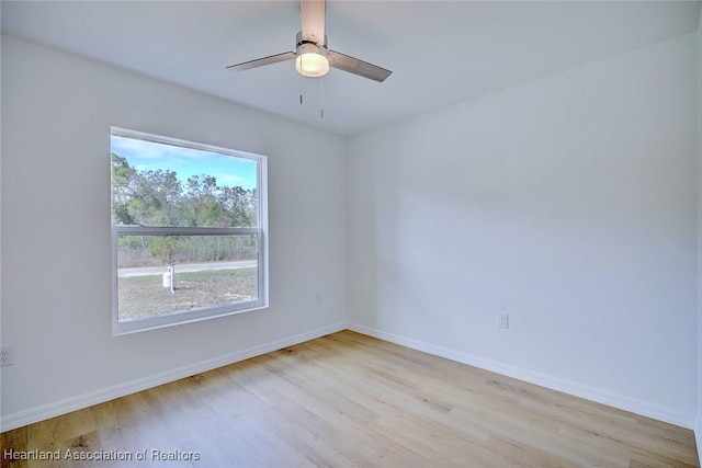 spare room with ceiling fan and light hardwood / wood-style flooring