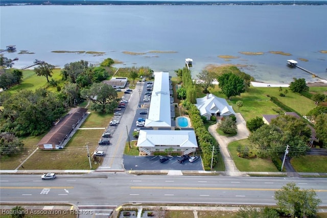 birds eye view of property with a water view