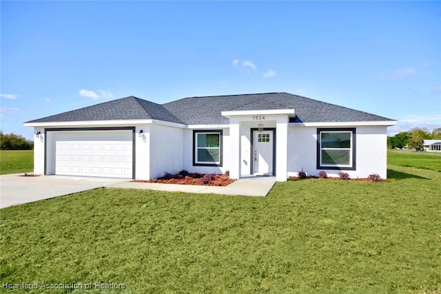 view of front facade with an attached garage, driveway, roof with shingles, stucco siding, and a front lawn