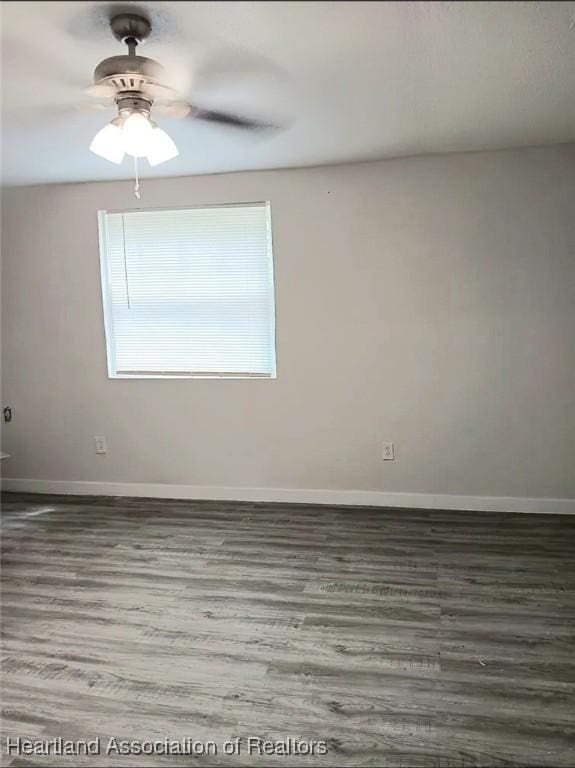 unfurnished room with hardwood / wood-style flooring and ceiling fan