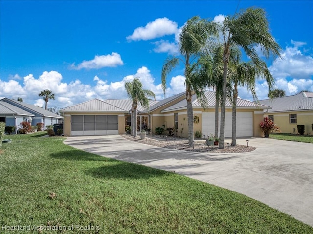 single story home with a garage and a front yard