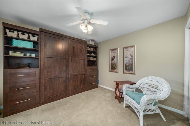 sitting room with light carpet and ceiling fan