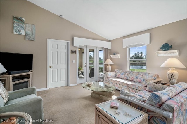 living room with carpet and vaulted ceiling