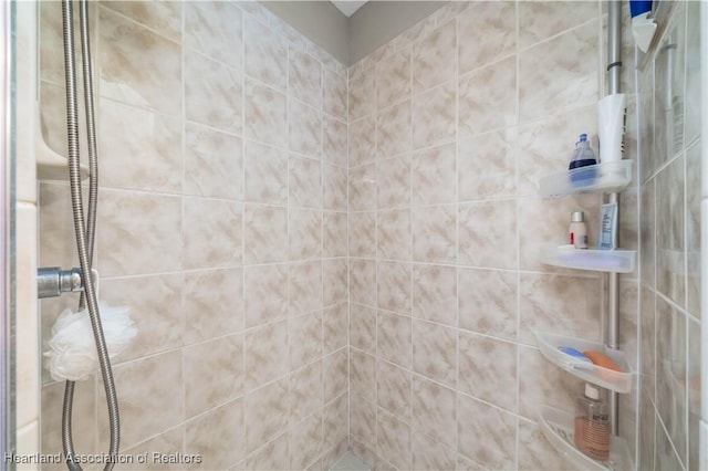 bathroom with a tile shower