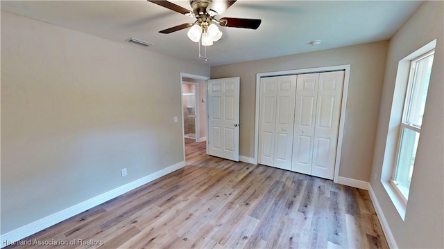 129 Badger Loop, Ona, FL 33865 - unfurnished bedroom featuring wood finished floors, a closet, and ceiling fan