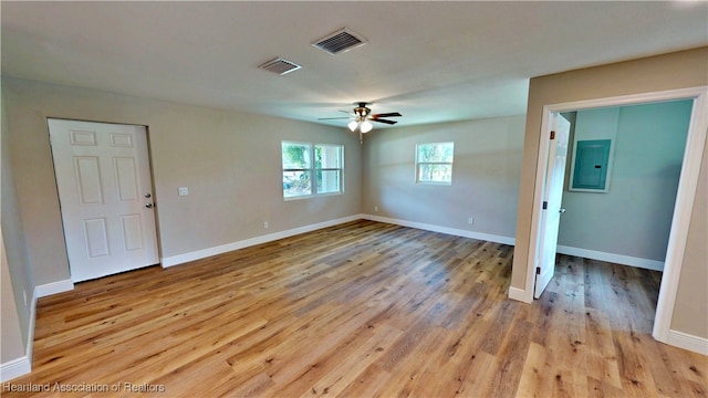 129 Badger Loop, Ona, FL 33865 - spare room featuring electric panel, light wood-style flooring, and a ceiling fan
