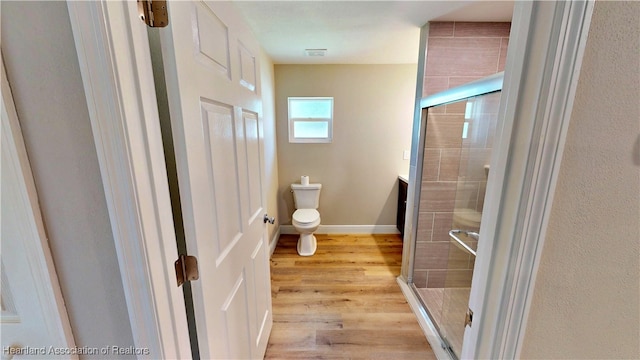 129 Badger Loop, Ona, FL 33865 - full bath featuring a stall shower and wood finished floors