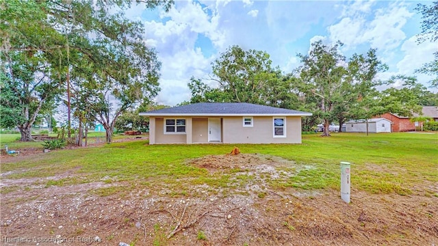 129 Badger Loop, Ona, FL 33865 - view of front of property featuring a front yard and stucco siding