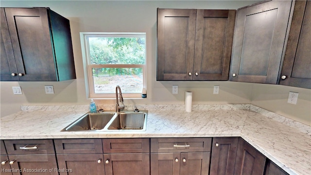 129 Badger Loop, Ona, FL 33865 - kitchen with a sink and dark brown cabinetry