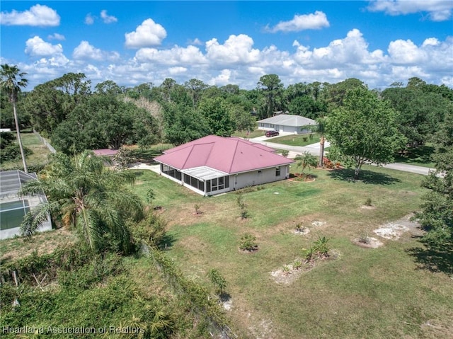 drone / aerial view with a view of trees