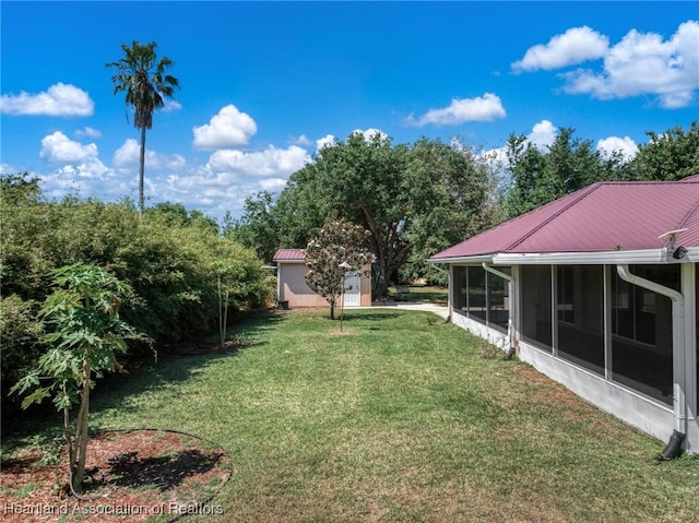 view of yard with a sunroom