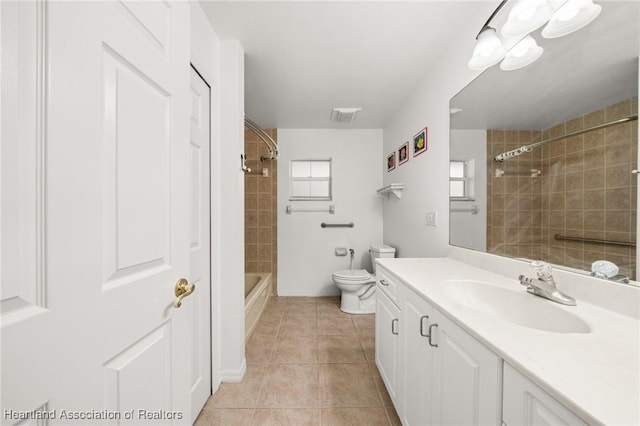 full bath with visible vents, tile patterned flooring, vanity, baseboards, and toilet