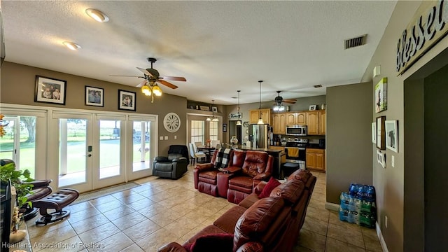 1779 State Road 62nd Rd, Bowling Green, FL 33834 - living area with a textured ceiling, french doors, ceiling fan, and visible vents