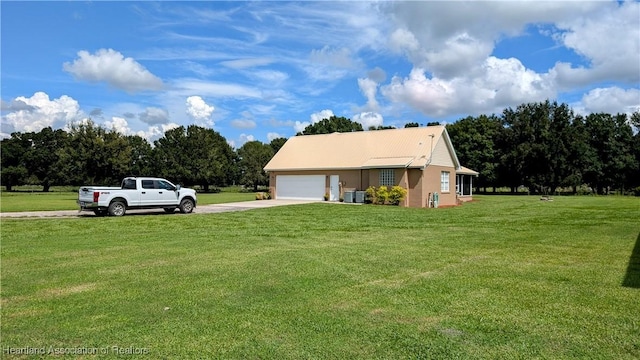 1779 State Road 62nd Rd, Bowling Green, FL 33834 - view of home's exterior featuring an attached garage, a lawn, and driveway