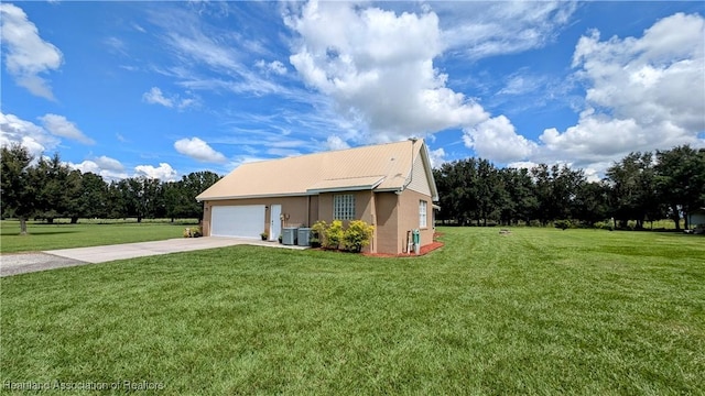 1779 State Road 62nd Rd, Bowling Green, FL 33834 - view of home's exterior with a yard, stucco siding, a garage, and concrete driveway